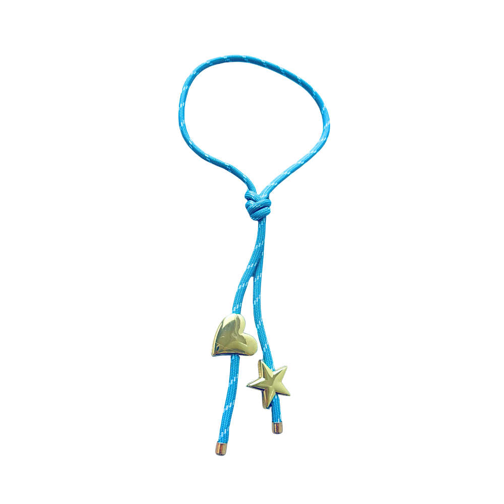 Light blue paracord wrap necklace designed to tie around the neck, featuring magnetic heart and star charms in 18K gold plating by Julie Saldivia
